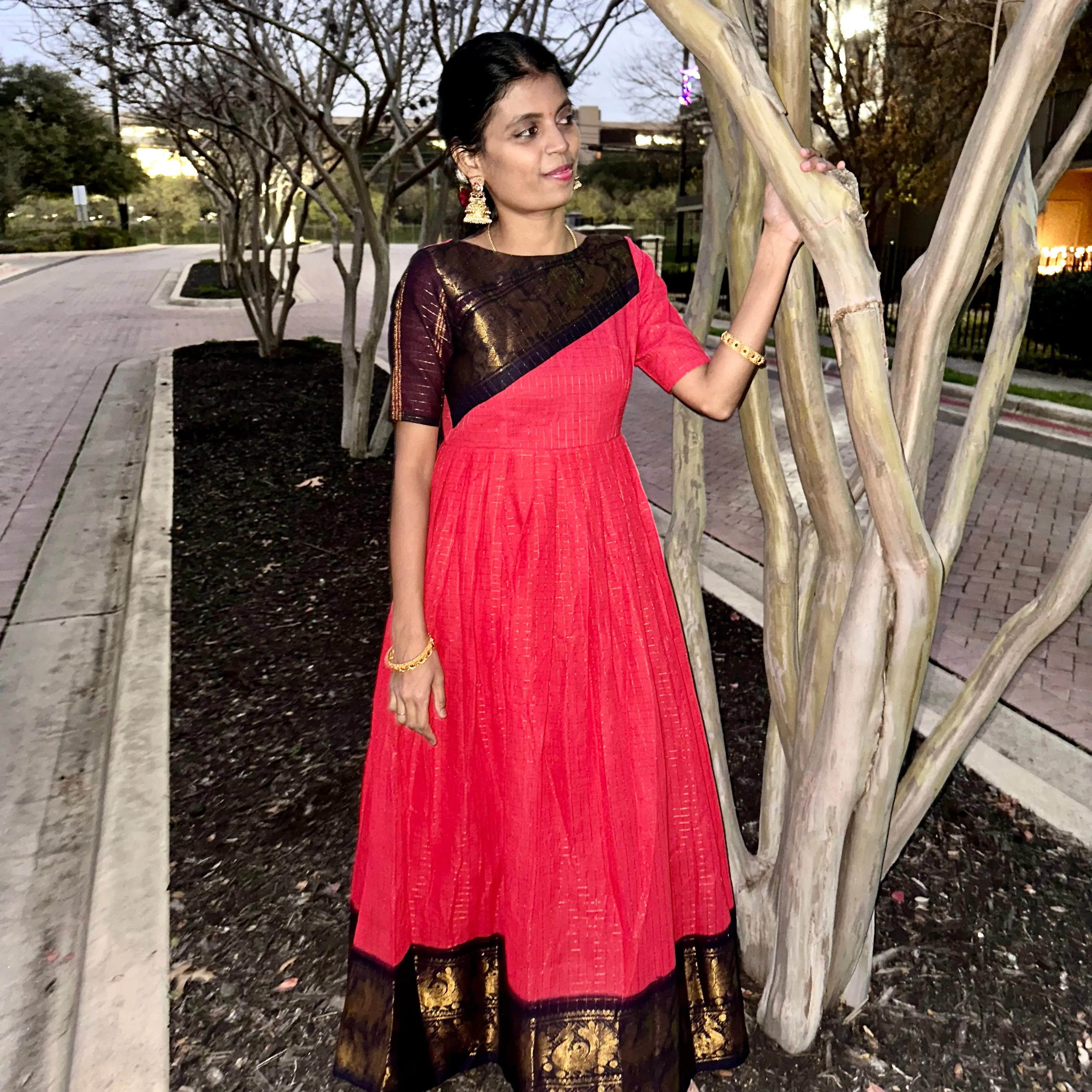Elegance Redefined: Pink Sungudi Gown with Stylish Pot Neck